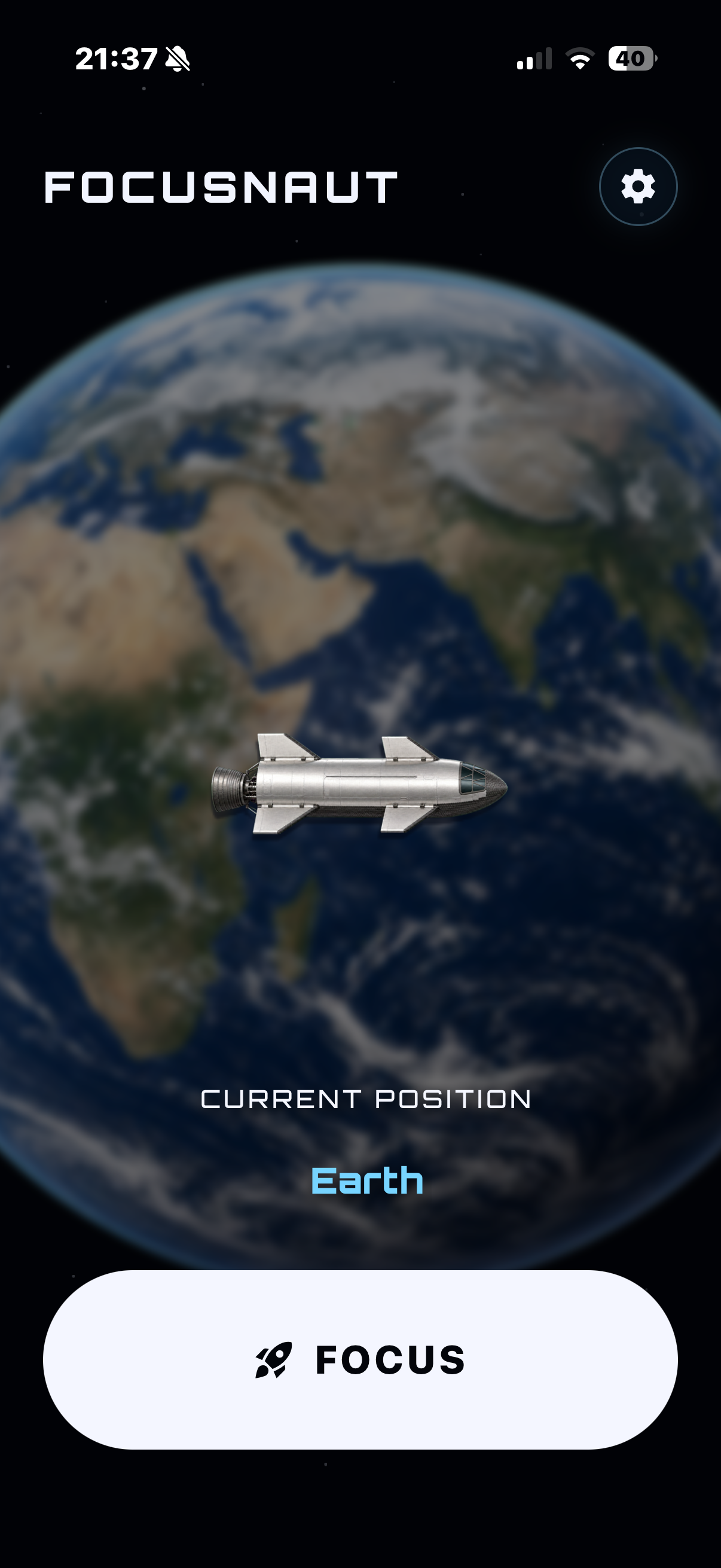 FOCUSNAUT on an iPhone, showing Earth, a spacecraft, and the focus button
